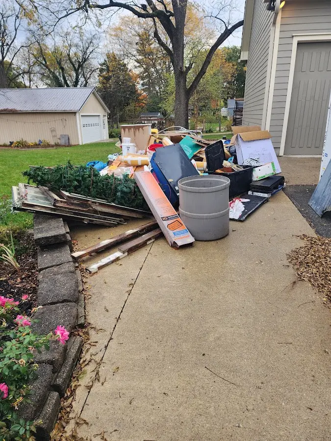 Dumpster being loaded with debris for 30 Yard Dumpster Rental in Leavenworth